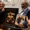 Mike Tyson standing next to portrait by Fabian Perez