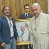 Pope Francis standing next to portrait by Fabian Perez