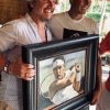 Rafael Nadal standing next to portrait by Fabian Perez