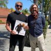 Sylvester Stallone holding art book by Fabian Perez
