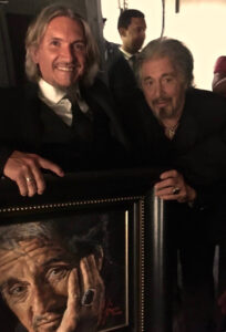 Al Pacino standing next to portrait by Fabian Perez