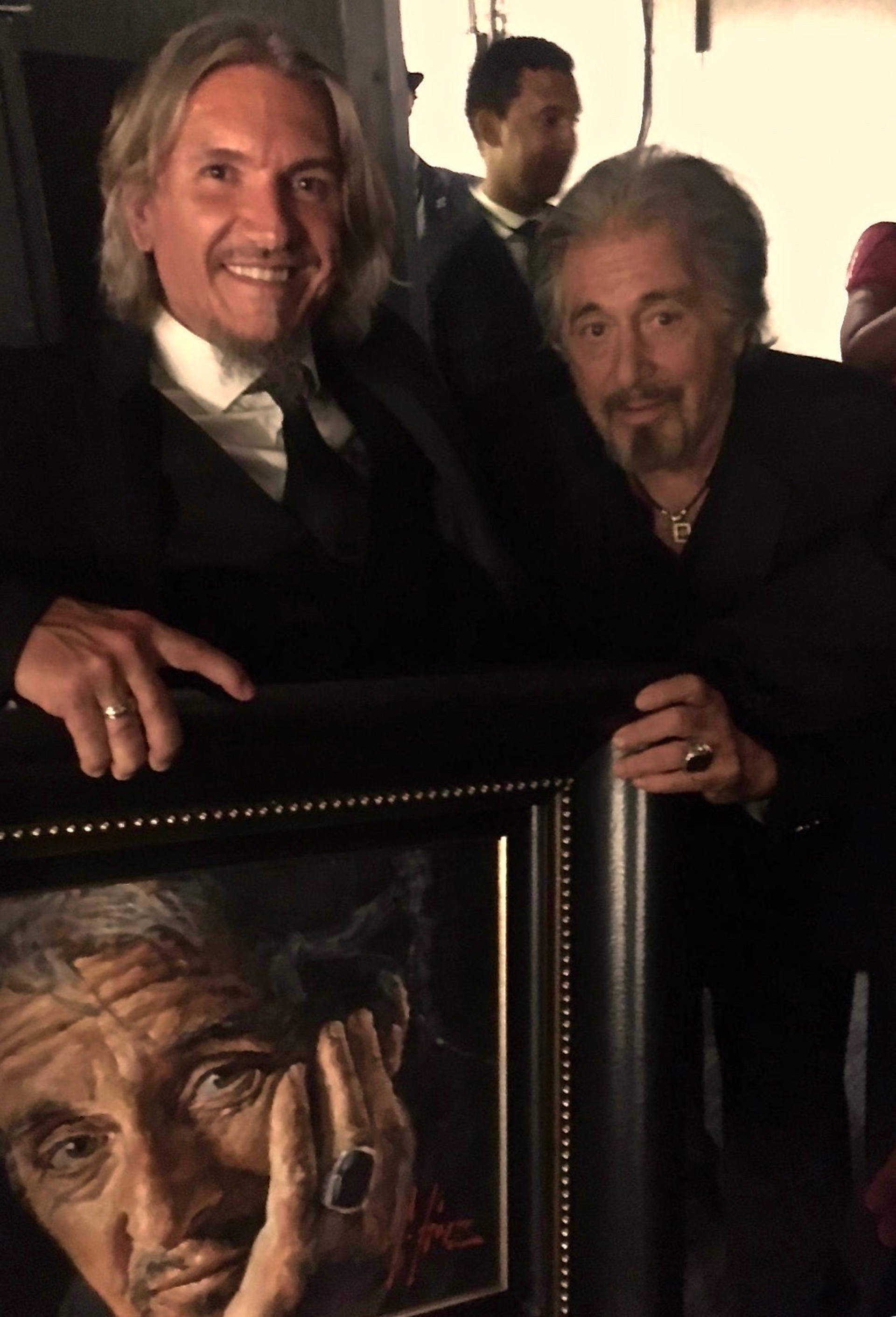 Al Pacino standing next to portrait by Fabian Perez