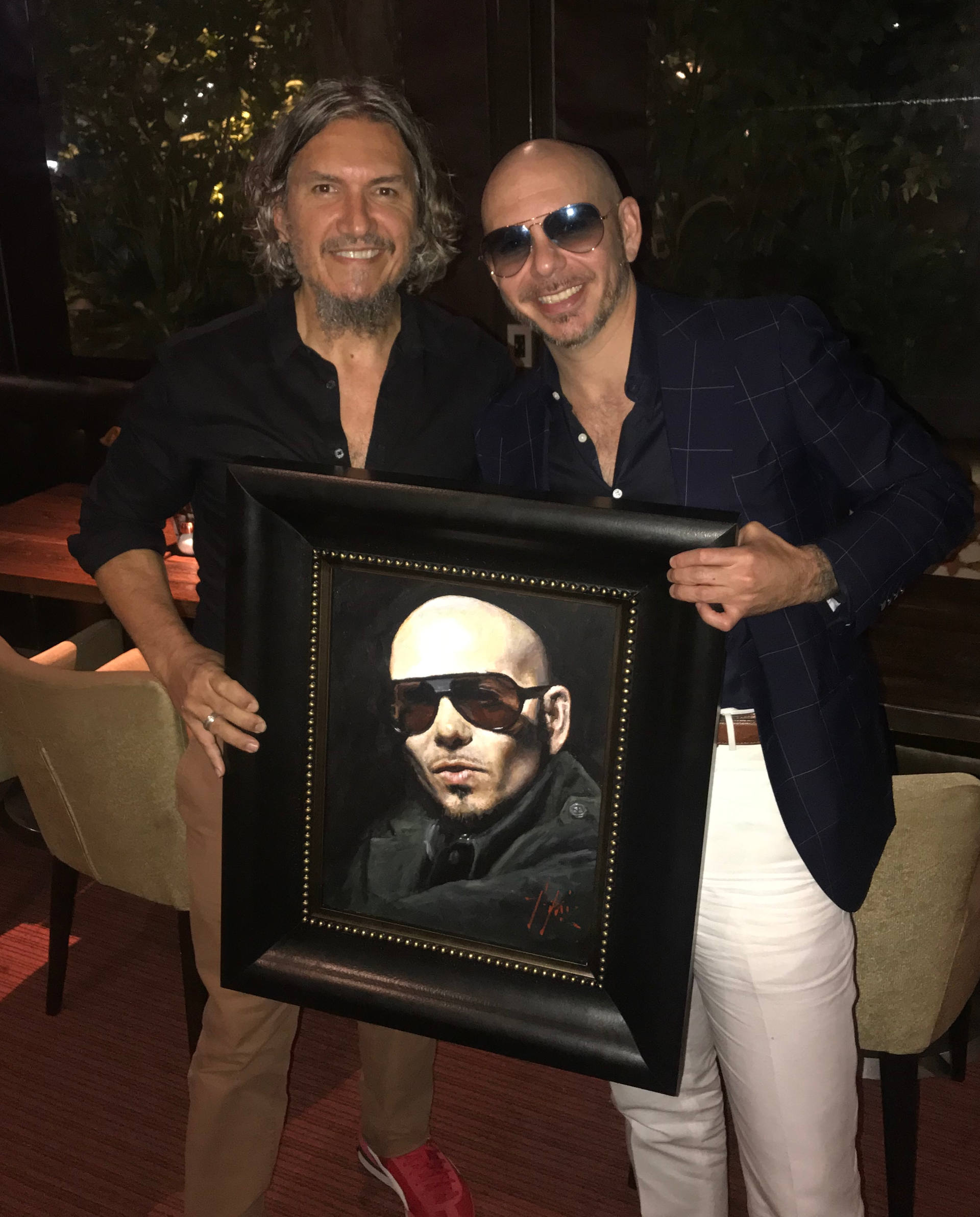 Pitbull holding portrait by painter Fabian Perez