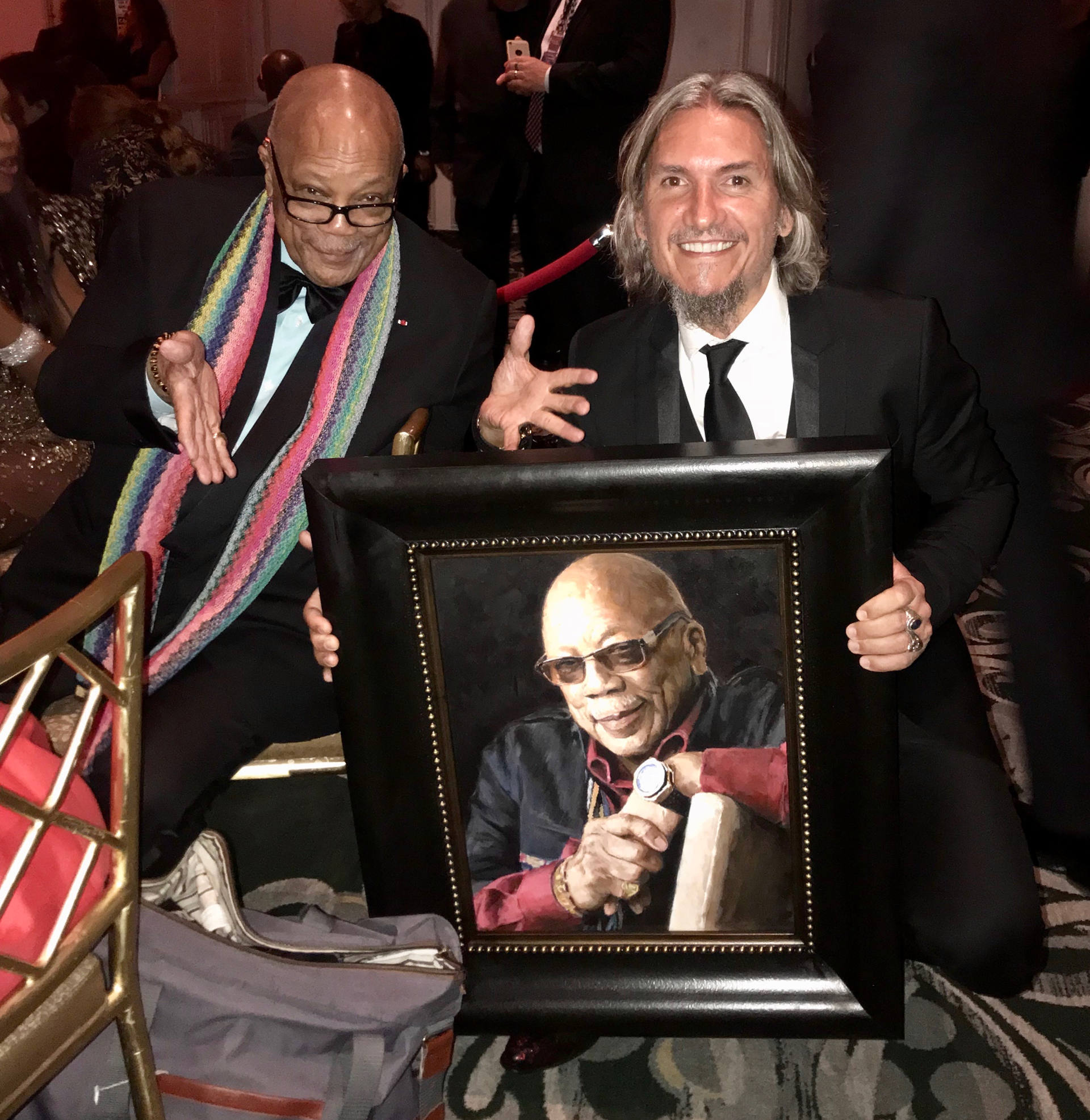 Quincy Jones standing next to portrait by Fabian Perez